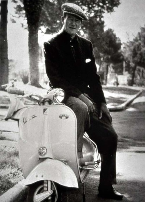 John Wayne vespa scooter.