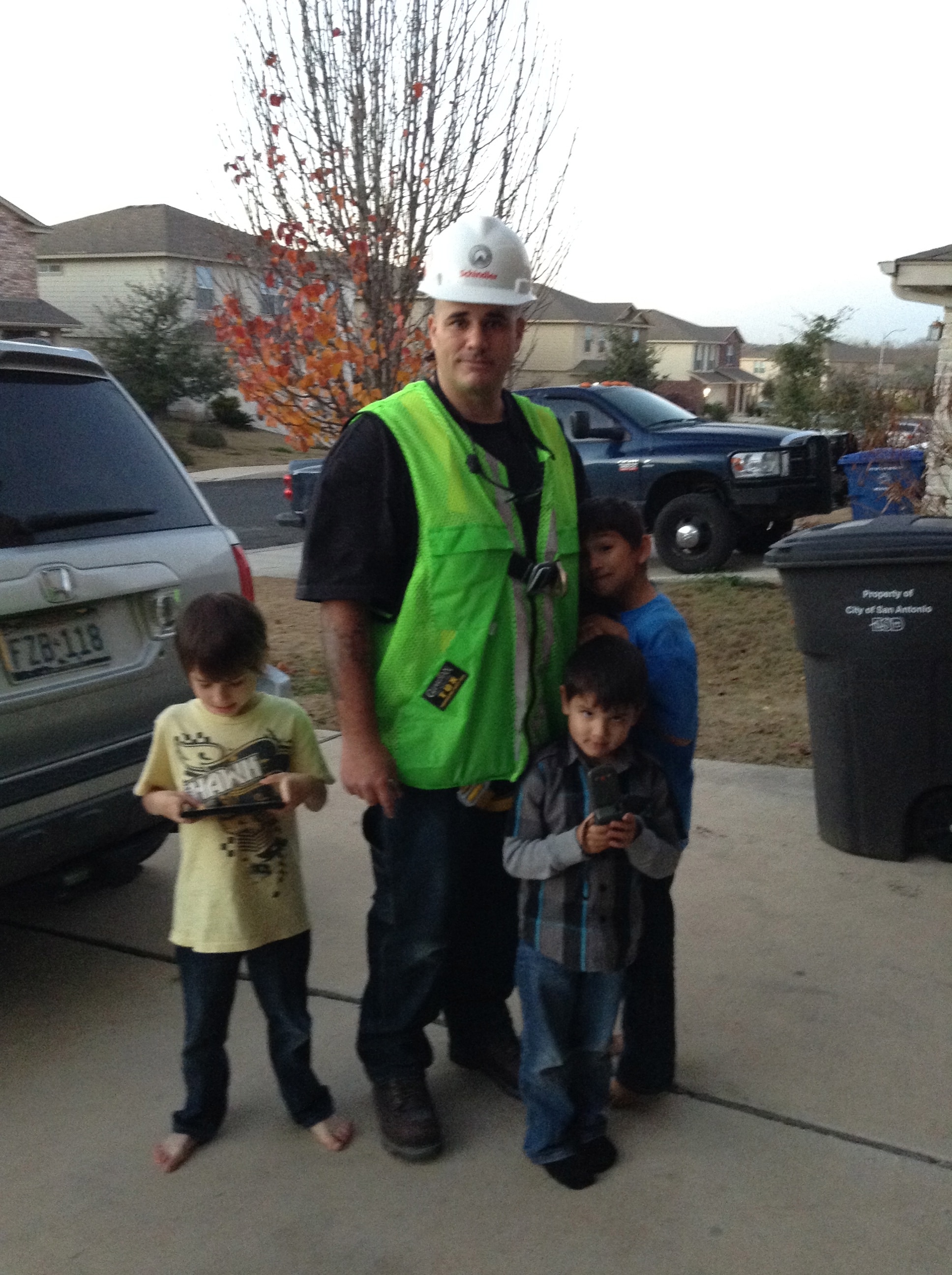 Casey with his kids, Preparing to head out for a day on the job.