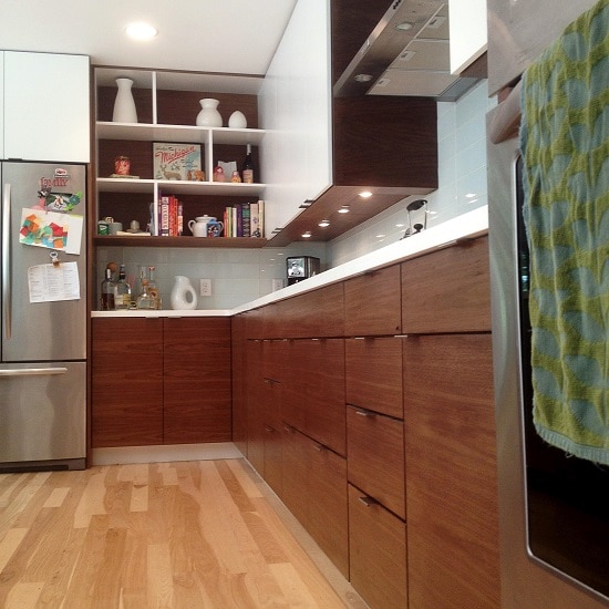 Fully furnished kitchen with wooden floor.