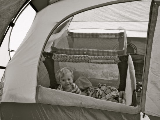 toddler in camping tent with pack n play