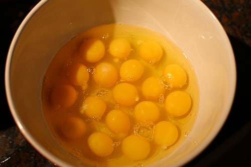 eggs in bowl for mixing homemade breakfast sandwiches
