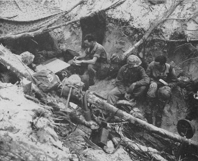 Vintage WWII soldiers in trench.