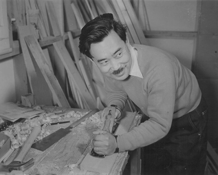 Vintage man asian american with wood planer mustache.