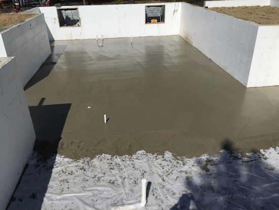 Applying cement on the foundation.