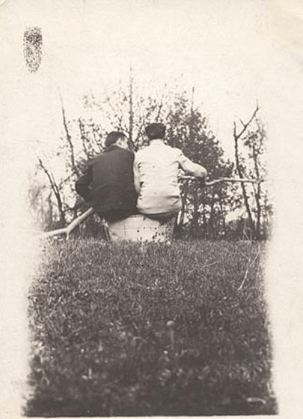 Vintage friends talking sitting outdoors. 