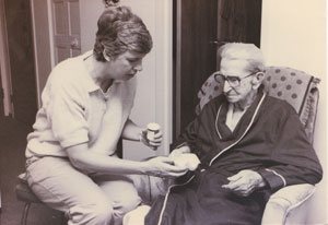 Barbara karnes hospice nurse giving medicine to an elderly man. 