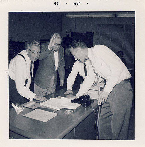 Vintage men working in office.