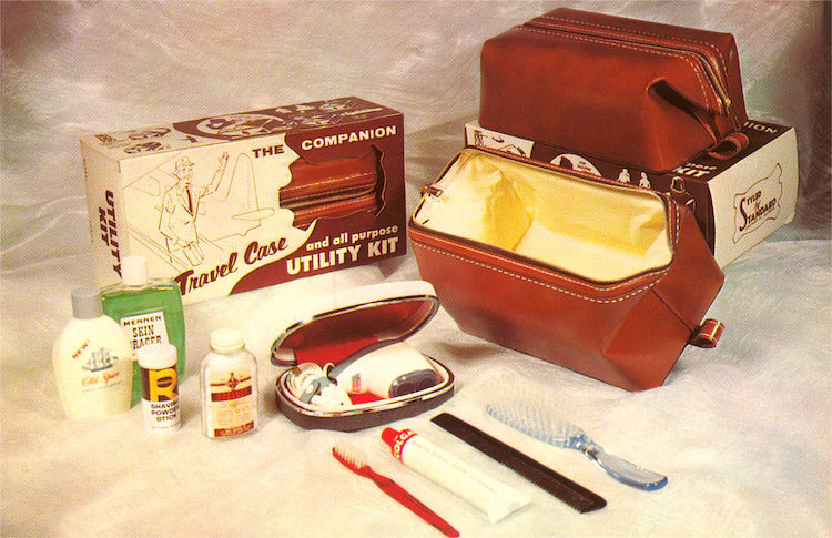 A brown leather Dopp Kit with a toothbrush, toothpaste, and other items.