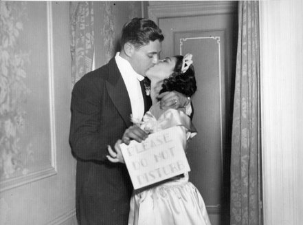 Vintage married couple kissing.