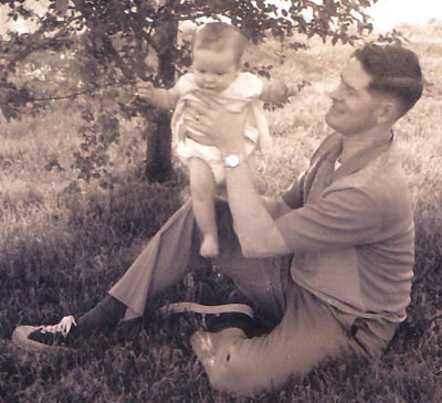 Vintage man holding baby.