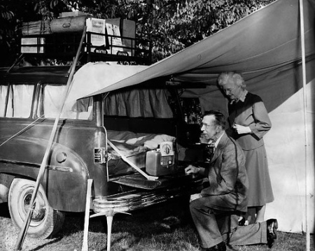 Vintage couple enjoying car camping.