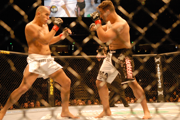 Men fighting in the ufc ring.