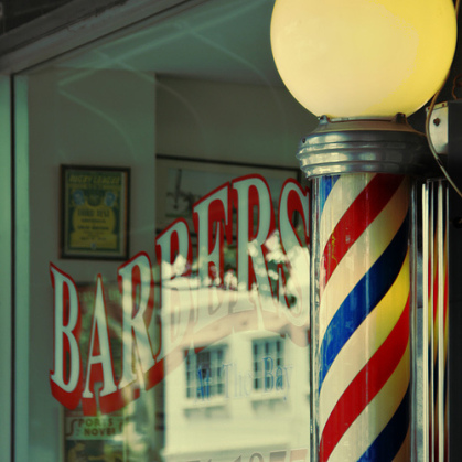 A barber pole in front of a Man's barbershop.