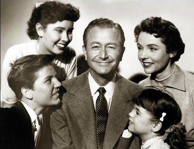 Jim Anderson with family portrait.