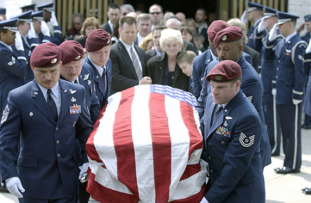 Soldiers carrying casket for funeral.