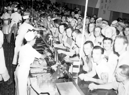 Vintage soda fountain filled with military men.