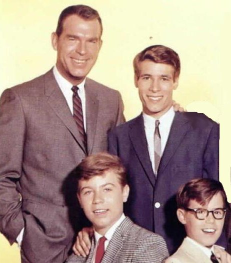 Steve Douglas standing with sons.