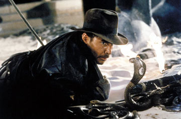 Indiana Jones encounters a treacherous snake while demonstrating his knowledge and bravery in the face of danger.