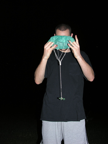 Man holding parachute firework.