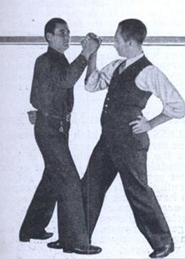 Vintage standing arm wrestling contest.