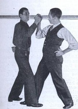 Two vintage gentlemen arm wrestling.