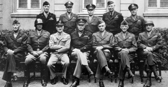 A group of men in military uniforms showcasing their leadership traits.