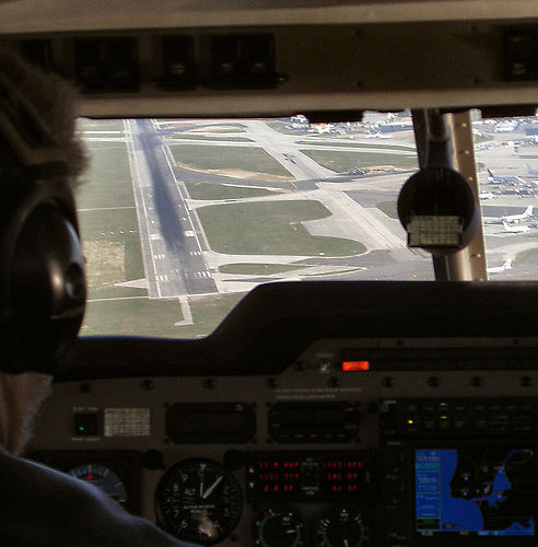 Approaching runway from airplane cockpit. 