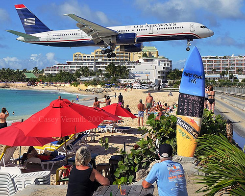 Us airways flying low over the beach.
