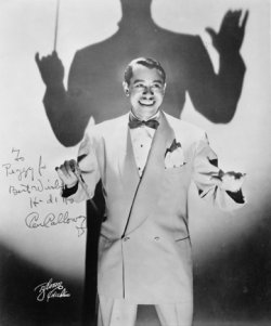 Cab Calloway singer with conductor's wand on stage.