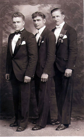 Vintage groomsmen standing for wedding portrait.