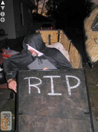 Halloween man coming out of coffin trick.