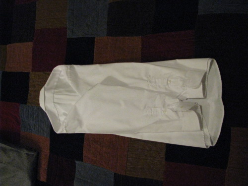Folding men's dress shirt for suitcase.