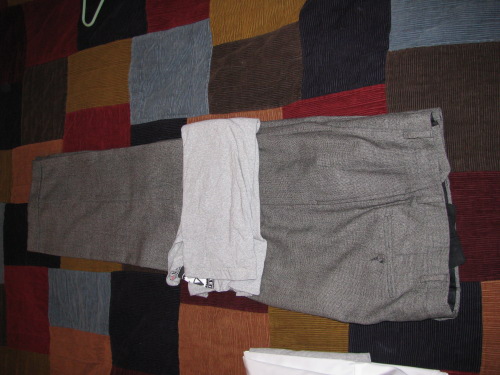 Slacks dress pants for suitcase.