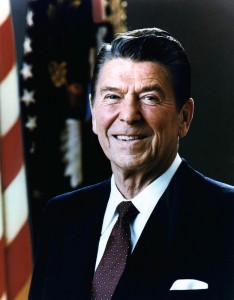 Ronald Reagan presidential in power suit smiling.