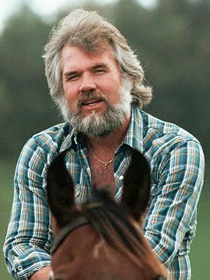 Kenny rogers on horseback beard famous facial hair.