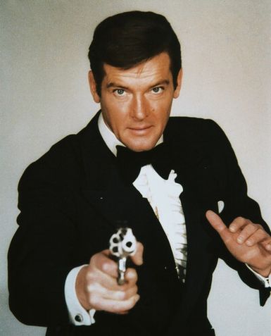 Roger Moore give posing with holding gun.