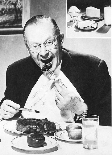 An old black and white photo of Grandpa's diet plan, showing a man eating a steak.