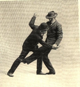 Vintage mnn sweeping kick aimed at the lower legs of an opponent.