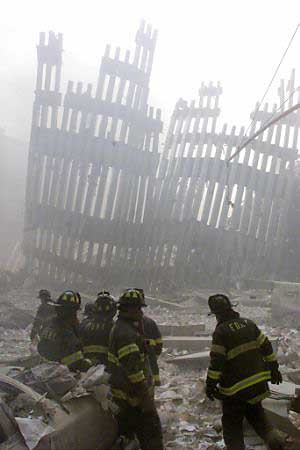 Firefighters working in front of twin towers.
