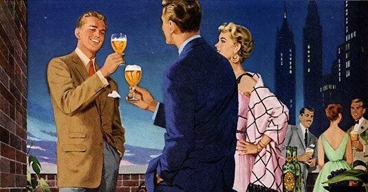 A man and woman are elegantly dressed, drinking wine on a balcony overlooking a wedding celebration.