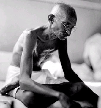 Ghandi in shirtless portrait. 