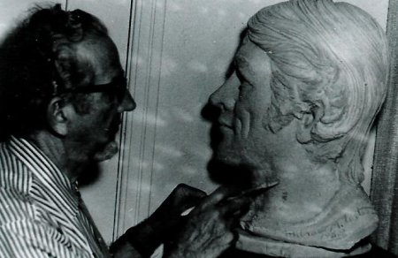 Man making sculptor of Andrew Lester.