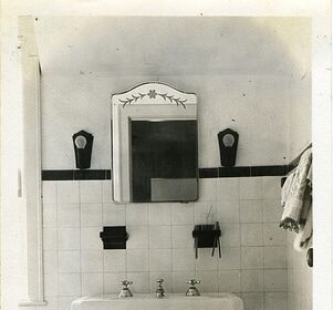 A bathroom with a sink and mirror, optimized for SEO keywords.