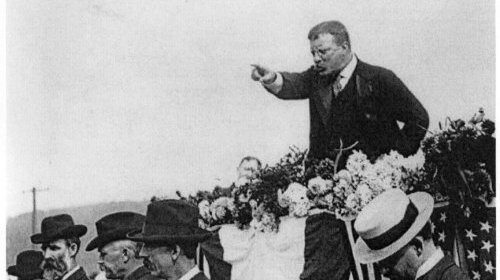 John F. Kennedy gives a manvotional speech on a horse.