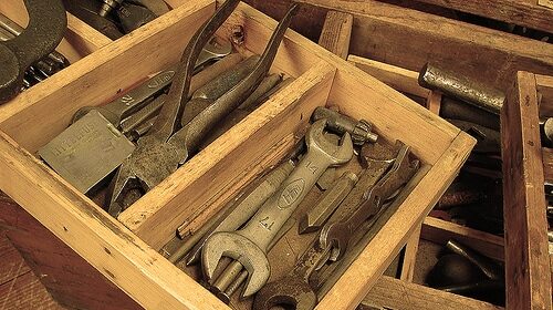 A toolbox filled with a variety of tools.