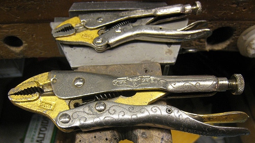 Toolbox of vise grip pliers.