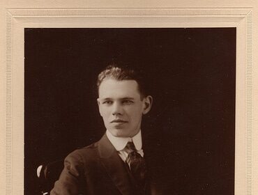 A timeless photograph capturing the essence of a man exuding life and integrity in his distinguished suit.