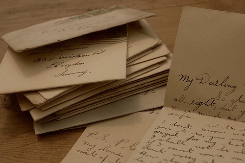 Stack of love letters in envelopes placed on the table.