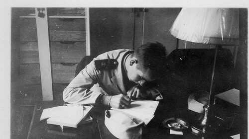 An artist creating a masterpiece at a well-lit desk.