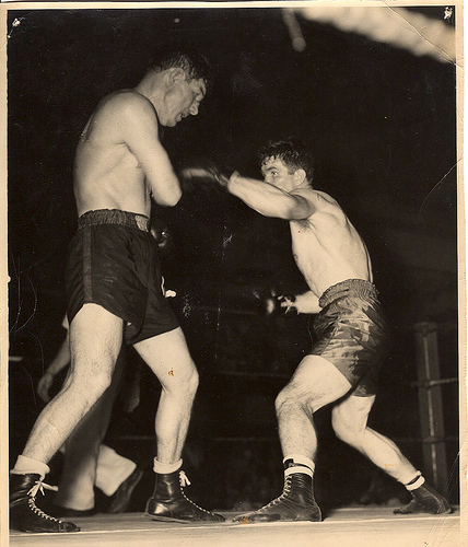 Vintage boxers fighting in the ring. 